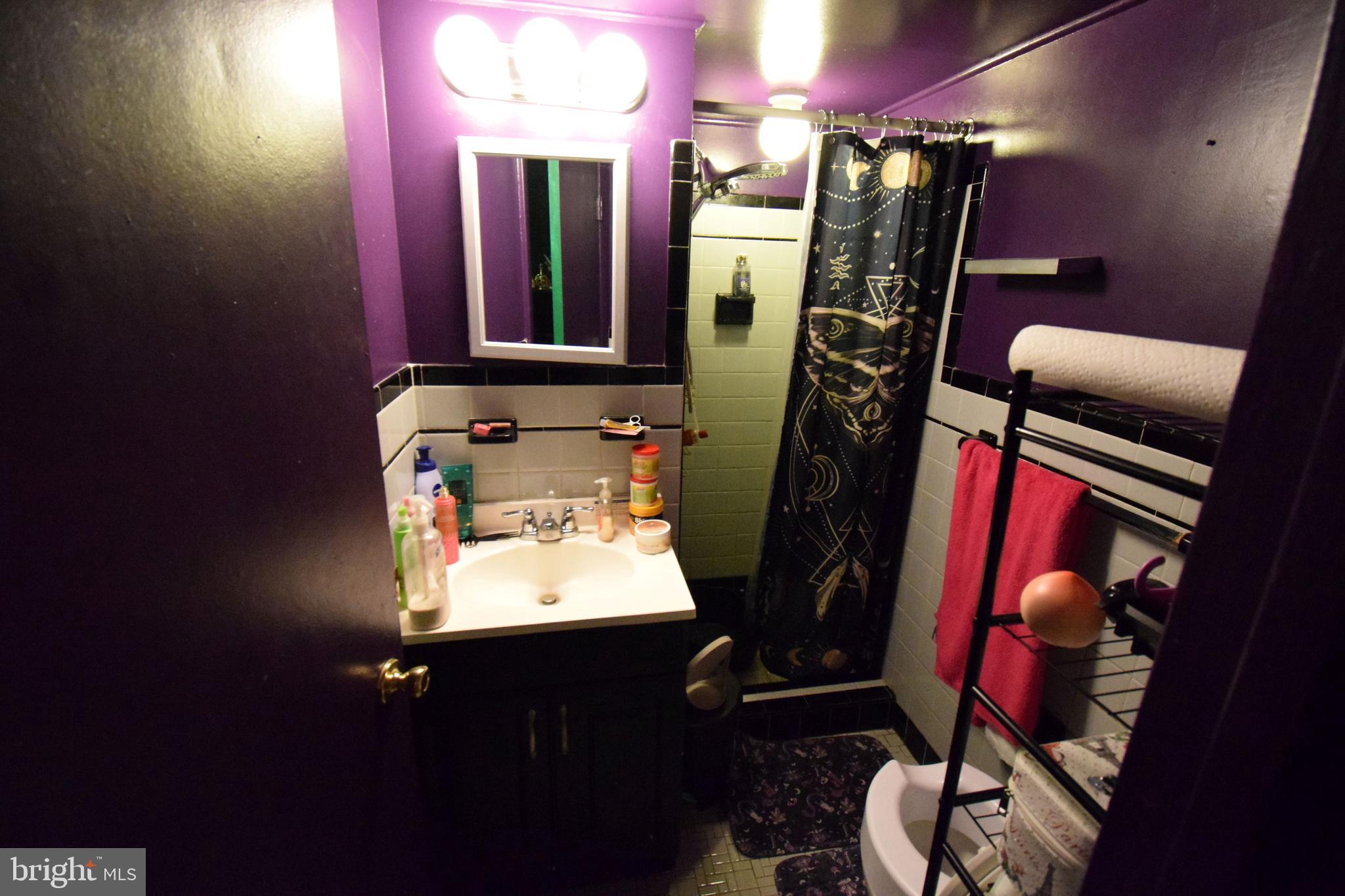 4605 Sharon Road Temple Hills, MD 20748 - Photo 17 of 19 a view of walk in closet with clothes and shoes