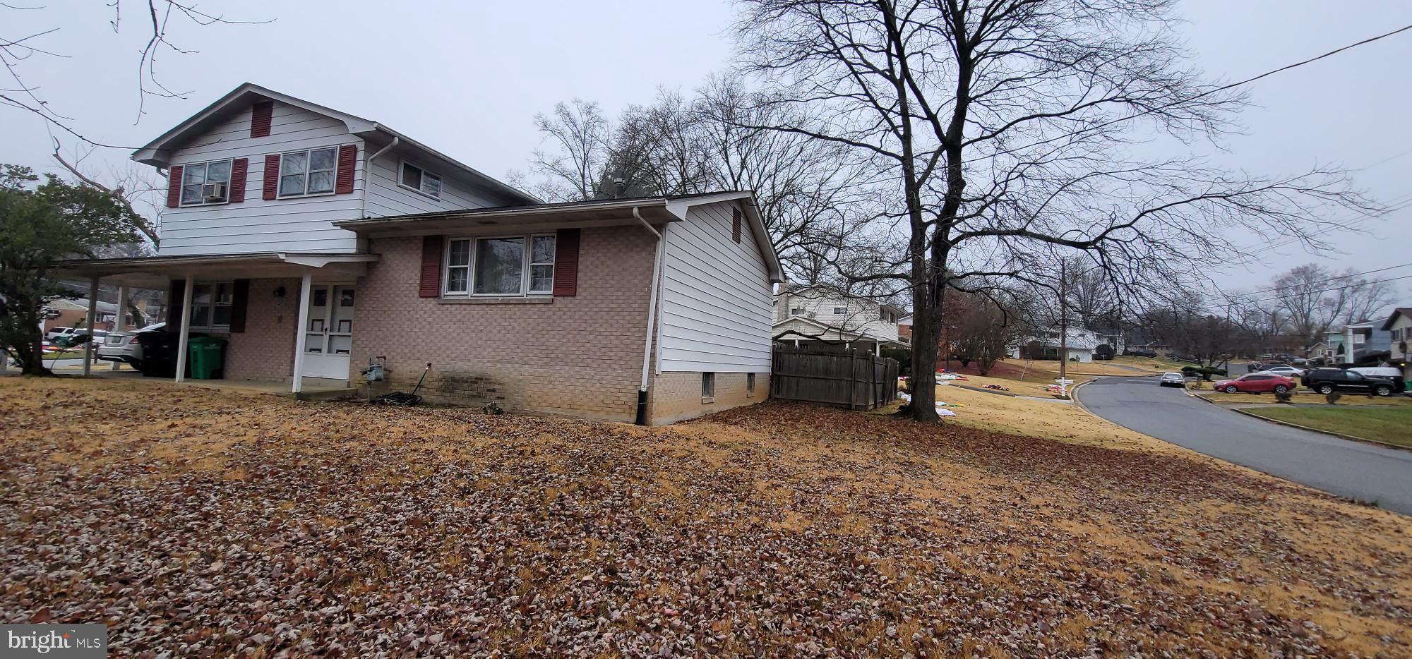 4605 Sharon Road Temple Hills, MD 20748 - Photo 3 of 19 a front view of a house with a yard and garage