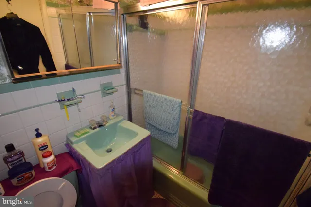 a bathroom with a sink a vanity and a mirror