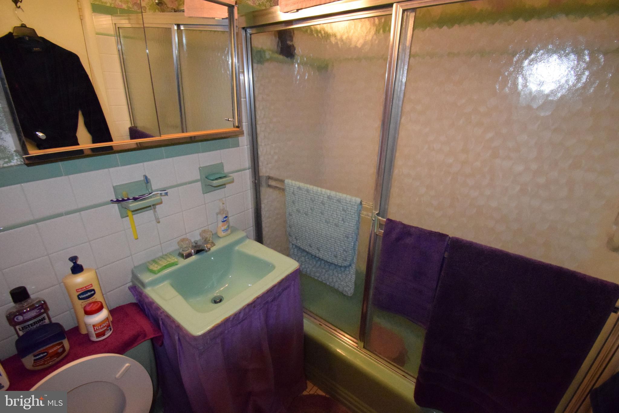 4605 Sharon Road Temple Hills, MD 20748 - Photo 6 of 19 a bathroom with a sink a vanity and a mirror