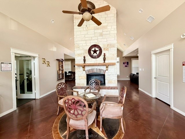 1000 Spring Loop, Unit 1806 College Station, TX 77840 - Photo 26 of 33 a living room with furniture a fireplace and a chandelier