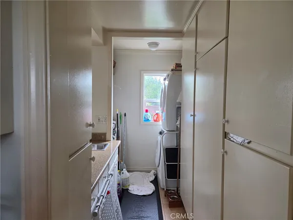 a bathroom with a sink and mirror with toilet