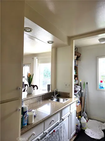 a bathroom with a sink double vanity and a mirror
