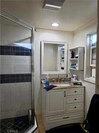 a bathroom with a double vanity sink and mirror