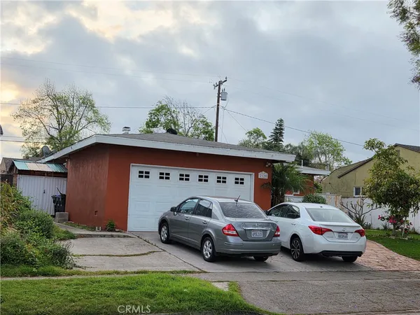 a view of parking space with cars parked