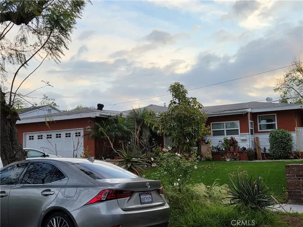 a car parked in front of a house