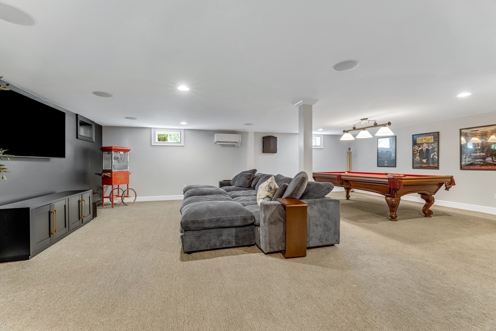 85 Old Farm Road Milton, MA 02186 - Photo 28 of 42 a living room with furniture and a flat screen tv