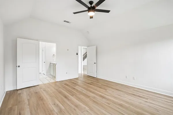 a bathroom with a shower sink and mirror