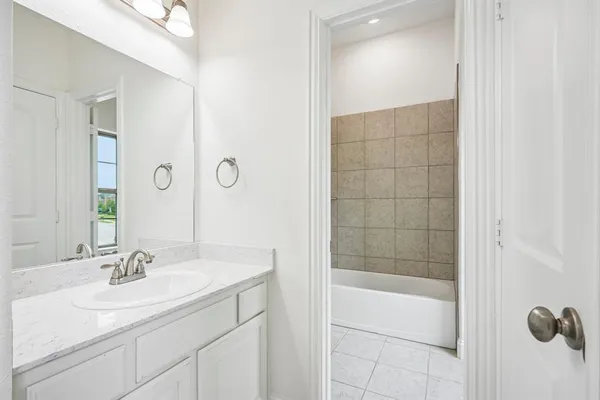 a bathroom with a sink toilet and mirror