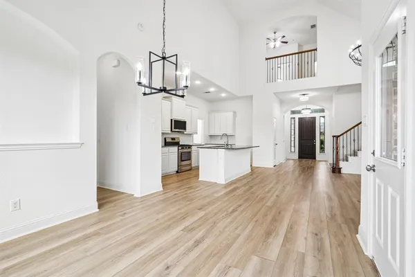 a view of a kitchen with wooden floor
