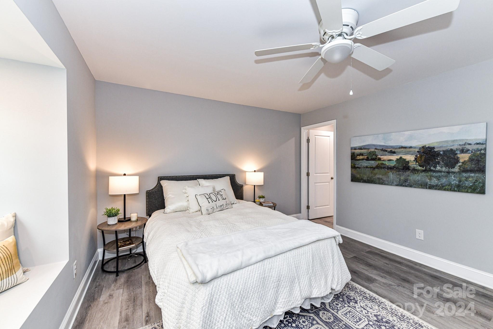 136 Spencer Avenue Northwest Concord, NC 28025 - Photo 18 of 43 a bedroom with a large bed and a window