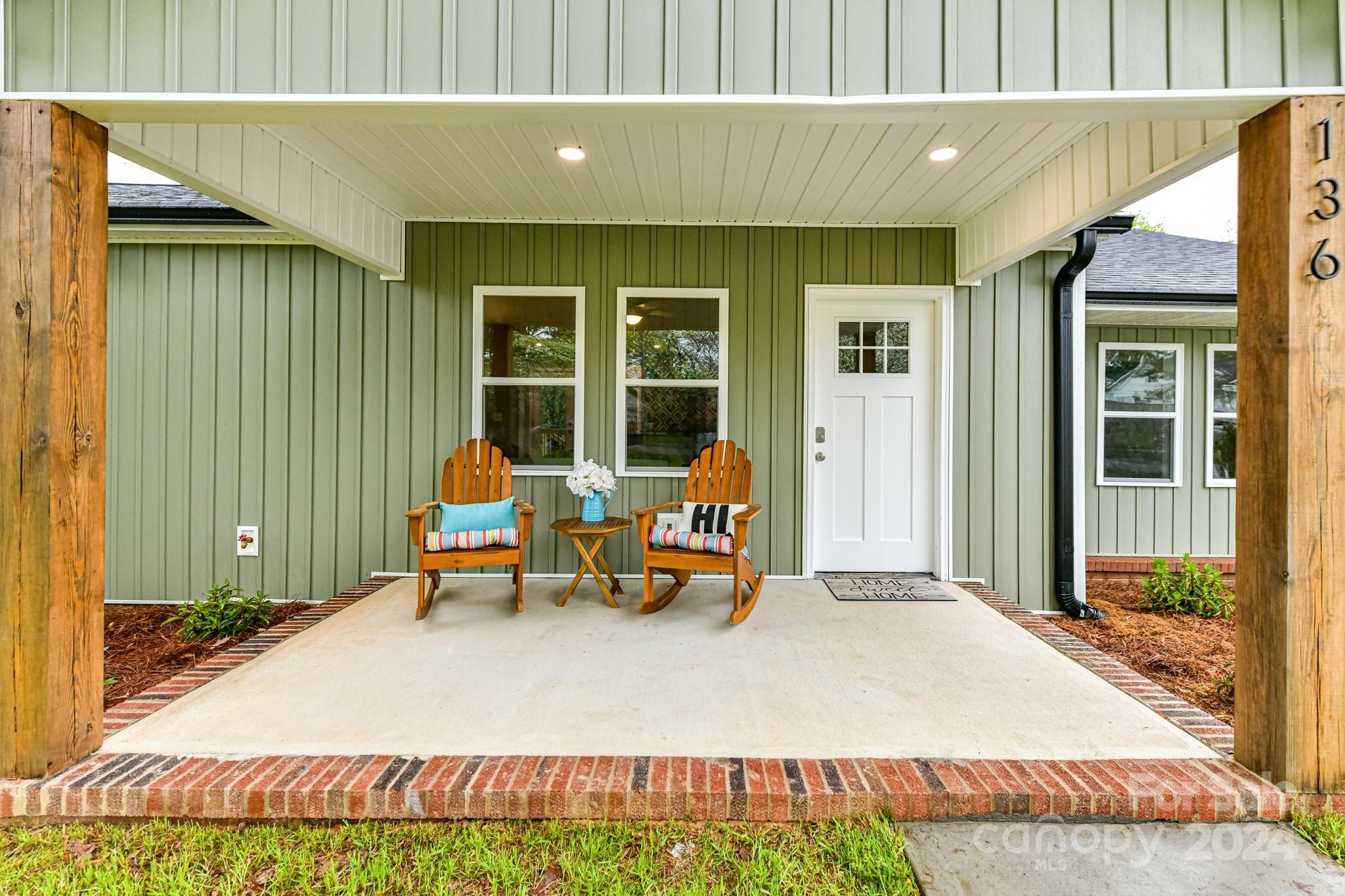 136 Spencer Avenue Northwest Concord, NC 28025 - Photo 2 of 43 a backyard of a house with outdoor seating