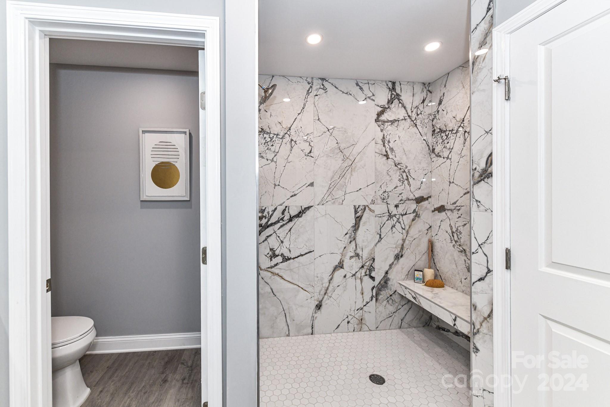 136 Spencer Avenue Northwest Concord, NC 28025 - Photo 22 of 43 a bathroom with a bathtub and a toilet