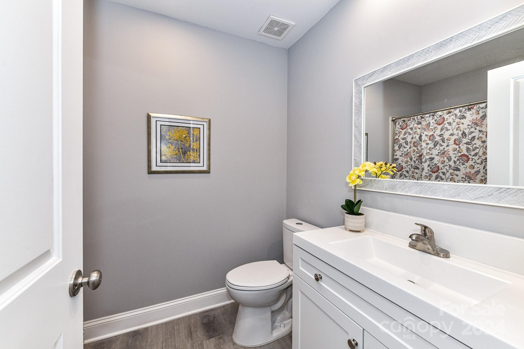 136 Spencer Avenue Northwest Concord, NC 28025 - Photo 24 of 43 a bathroom with a sink toilet and vanity