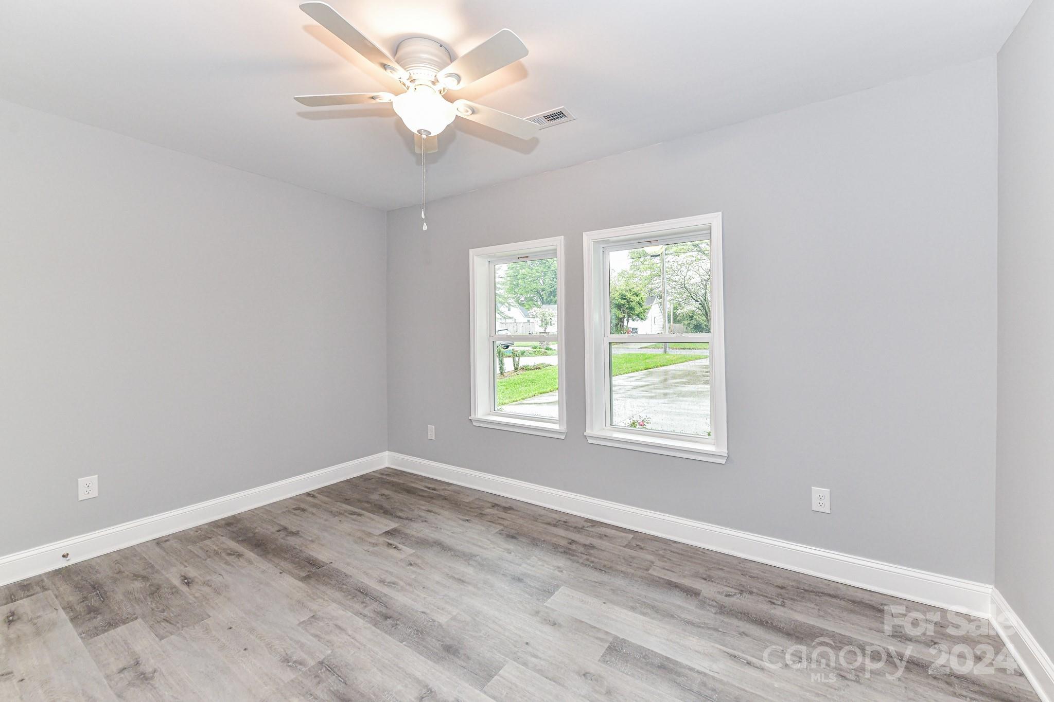 136 Spencer Avenue Northwest Concord, NC 28025 - Photo 26 of 43 a view of an empty room with a window