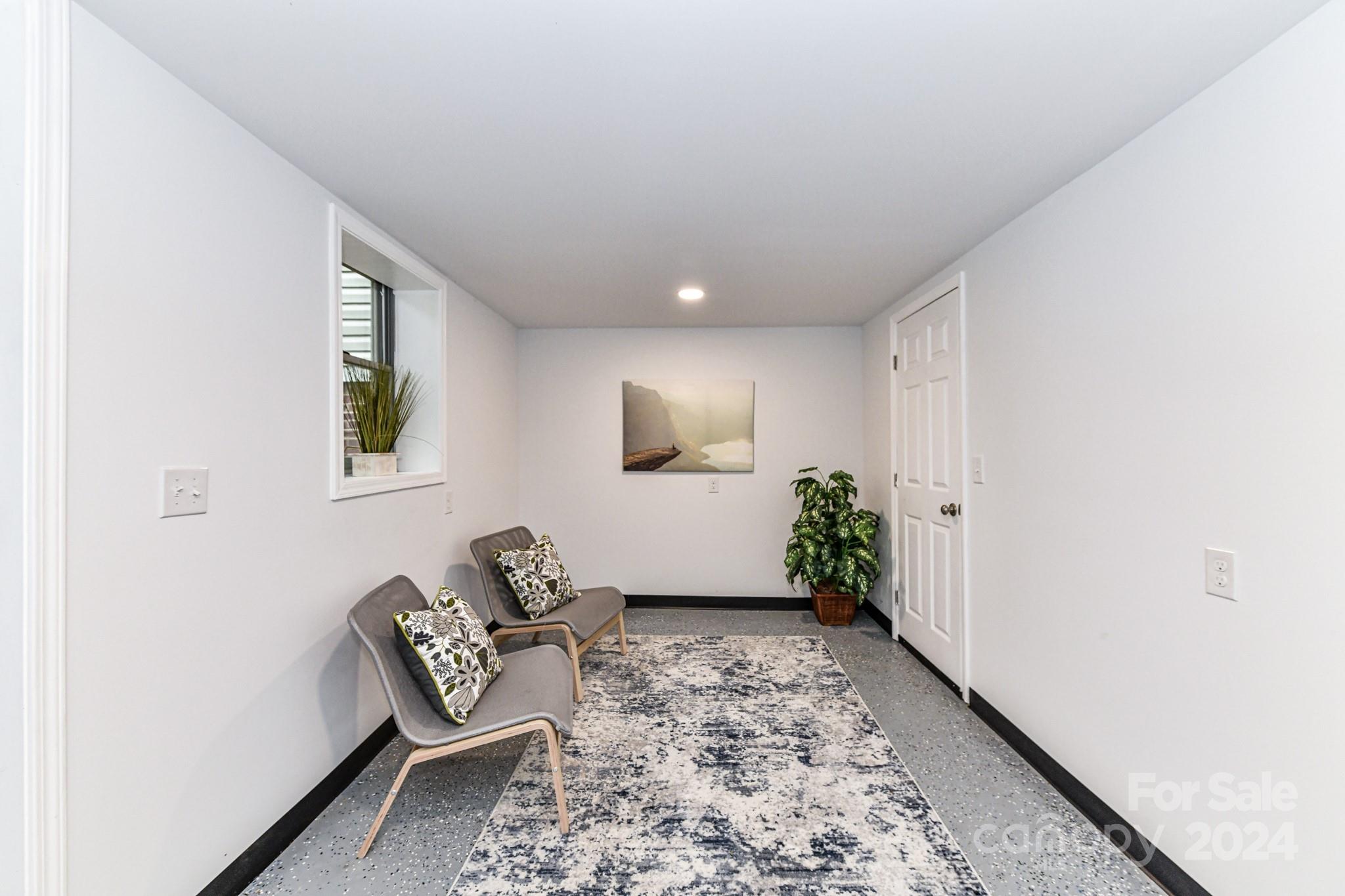 136 Spencer Avenue Northwest Concord, NC 28025 - Photo 30 of 43 a room with furniture and a window