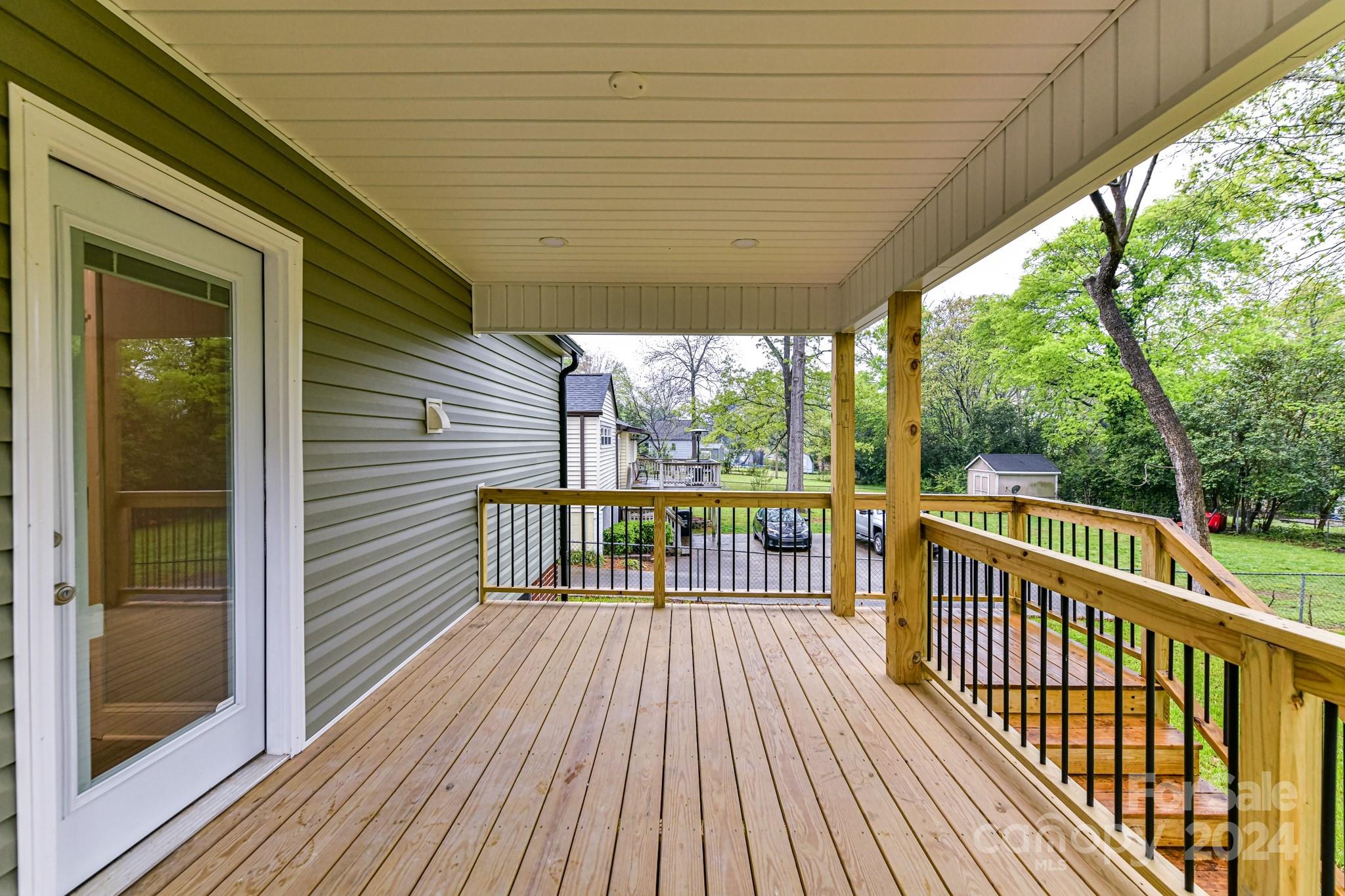 136 Spencer Avenue Northwest Concord, NC 28025 - Photo 32 of 43 a view of a wooden deck