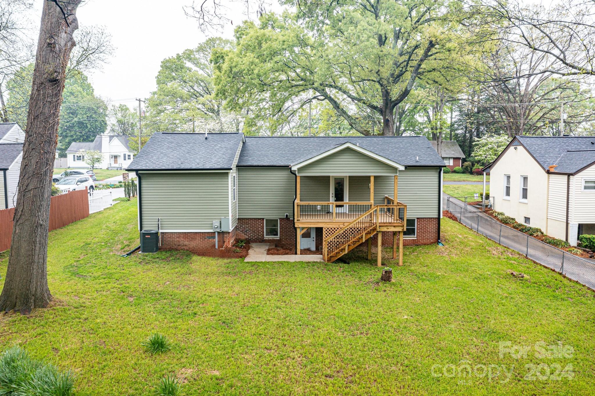 136 Spencer Avenue Northwest Concord, NC 28025 - Photo 34 of 43 a view of a house with backyard porch and sitting area