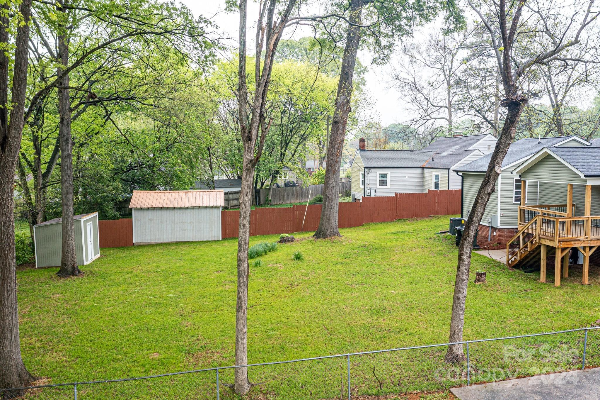 136 Spencer Avenue Northwest Concord, NC 28025 - Photo 35 of 43 a backyard of a house with table and sofas
