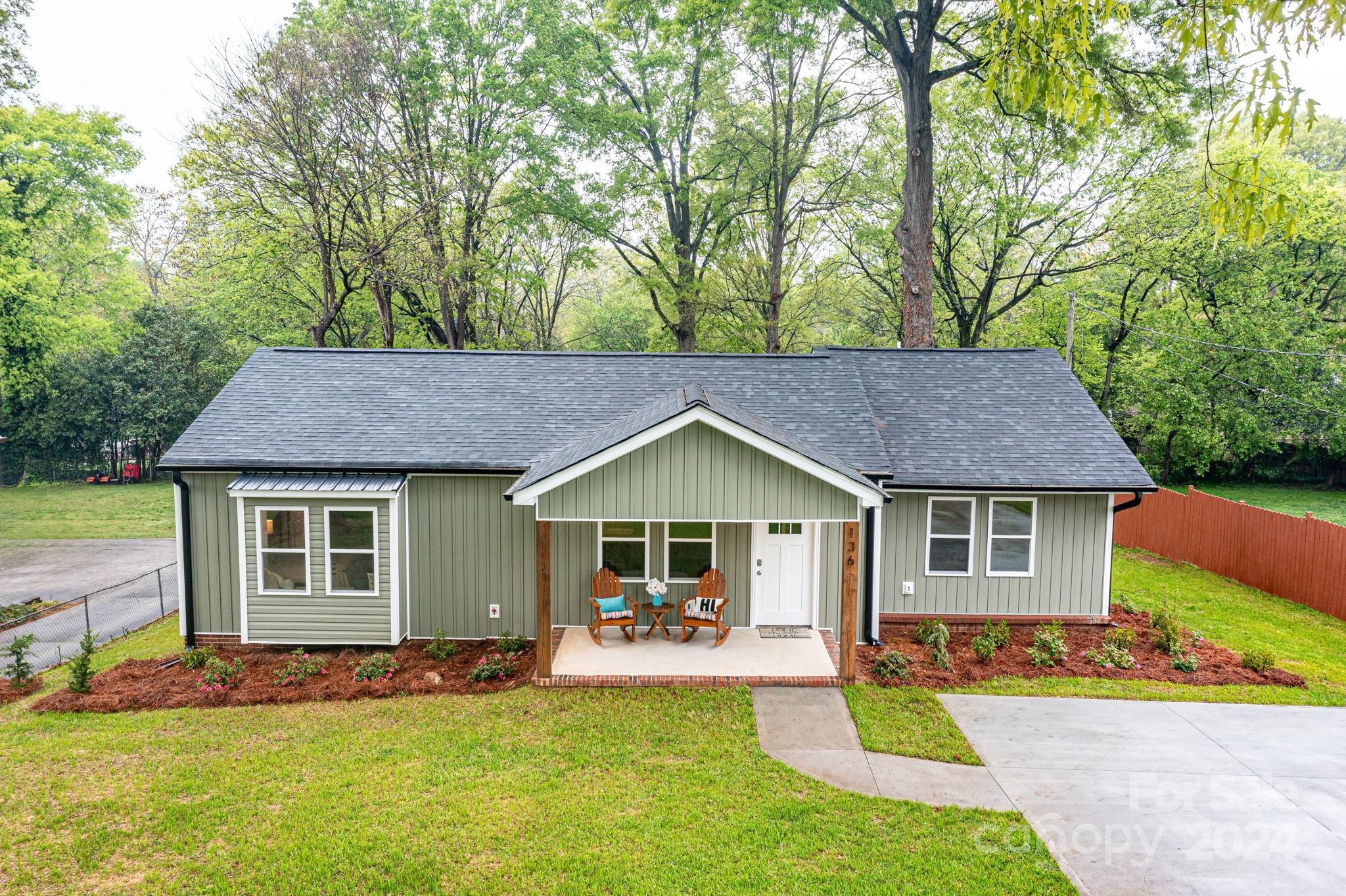 136 Spencer Avenue Northwest Concord, NC 28025 - Photo 42 of 43 a house view with a seating space and garden