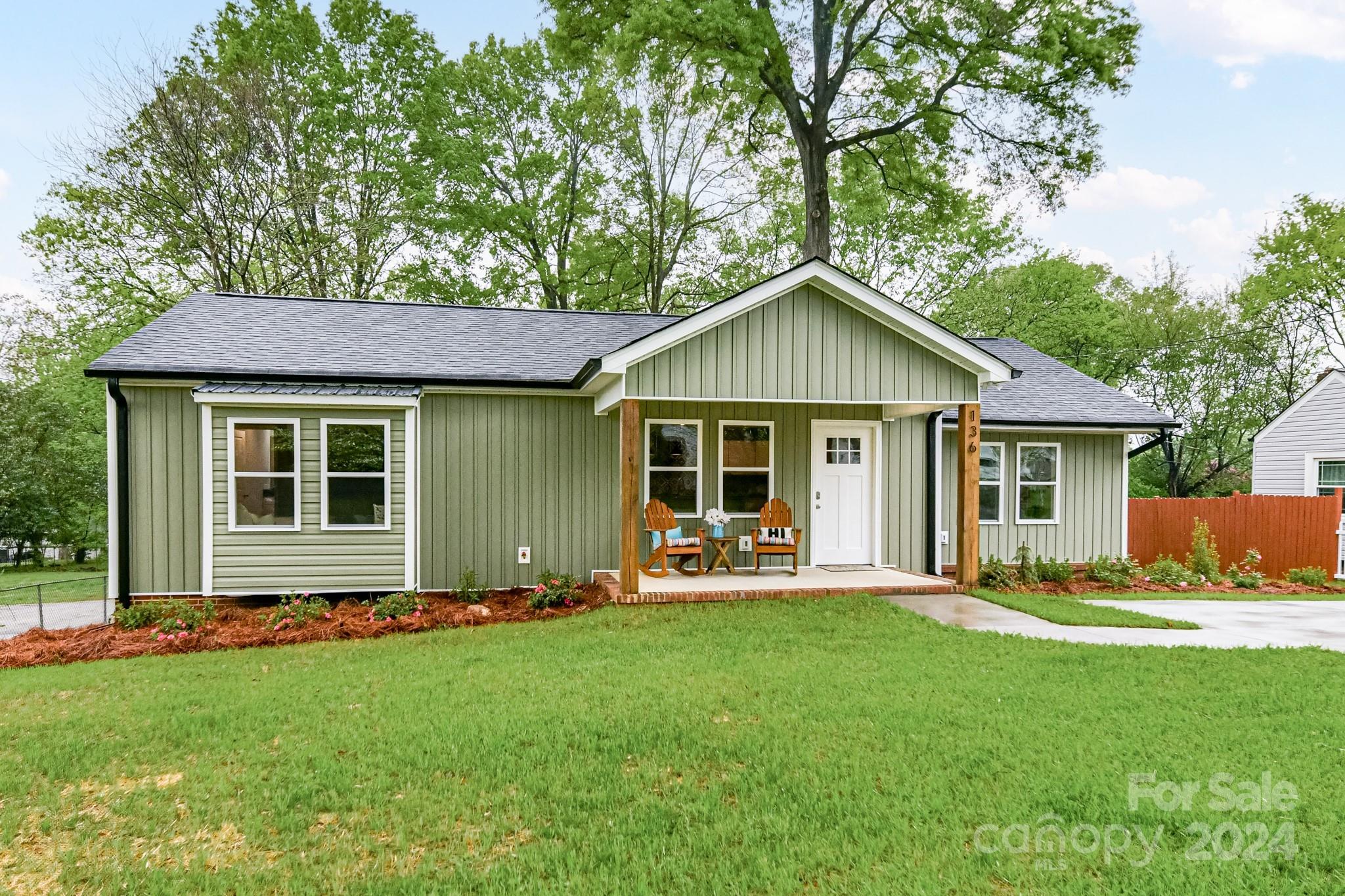 136 Spencer Avenue Northwest Concord, NC 28025 - Photo 43 of 43 a front view of a house with a yard and trees