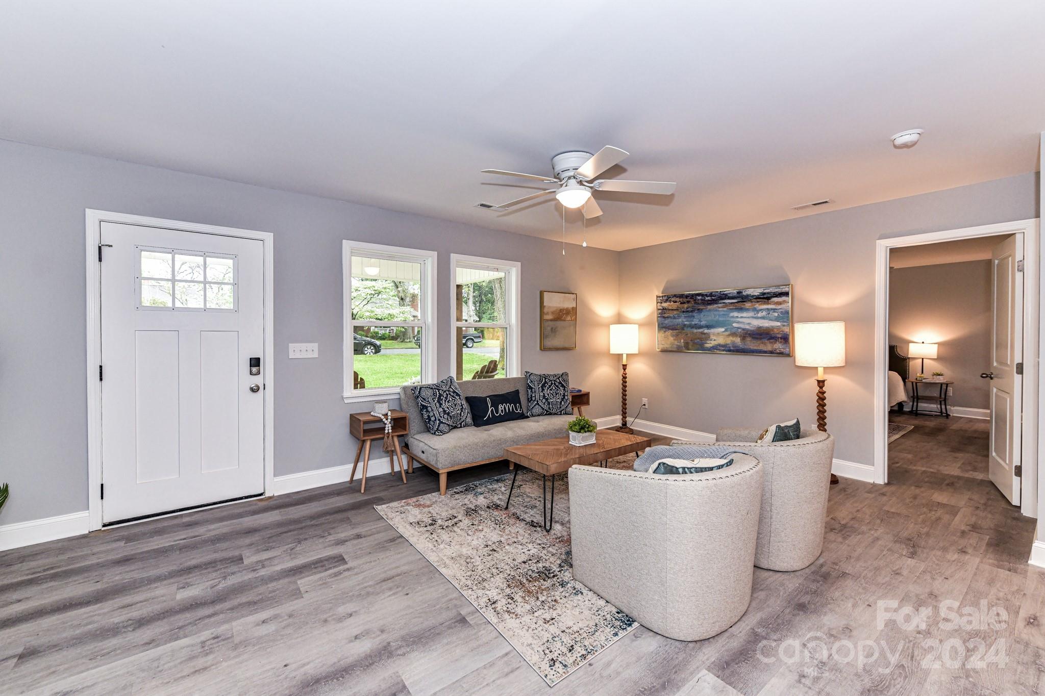 136 Spencer Avenue Northwest Concord, NC 28025 - Photo 6 of 43 a living room with furniture and a window