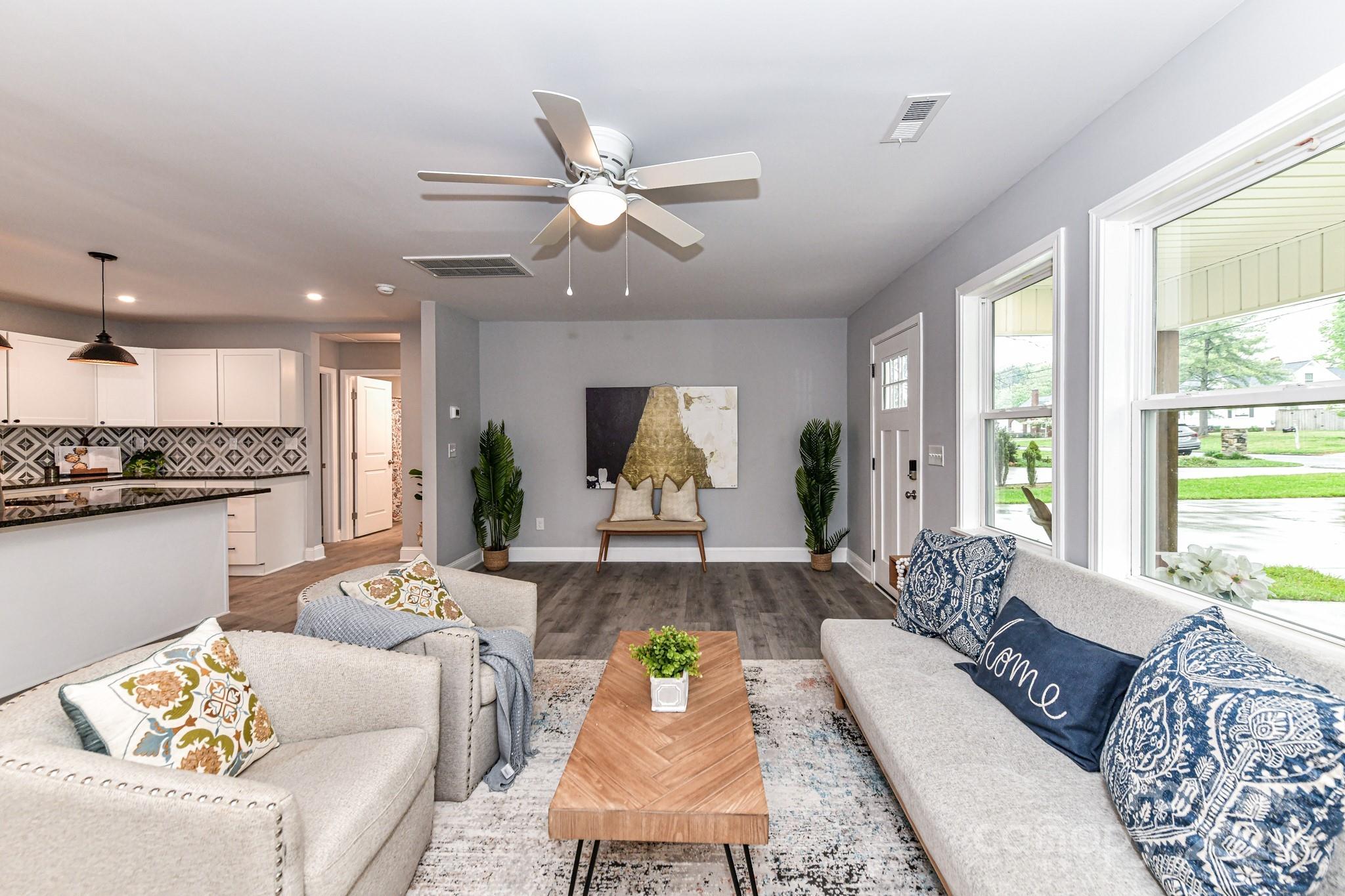136 Spencer Avenue Northwest Concord, NC 28025 - Photo 9 of 43 a living room with furniture and a large window