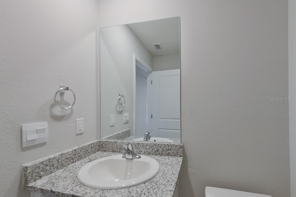 4397 Southwest 85th Lane Ocala, FL 34476 - Photo 9 of 23 a bathroom with a sink and a mirror