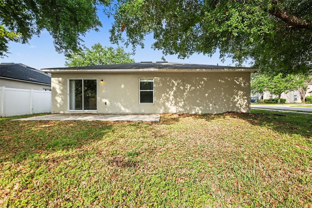 2212 Nicollett Way Leesburg, FL 34748 - Photo 24 of 26 a view of a house with a yard