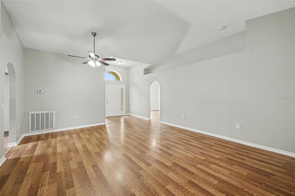 2212 Nicollett Way Leesburg, FL 34748 - Photo 9 of 26 a view of empty room with wooden floor