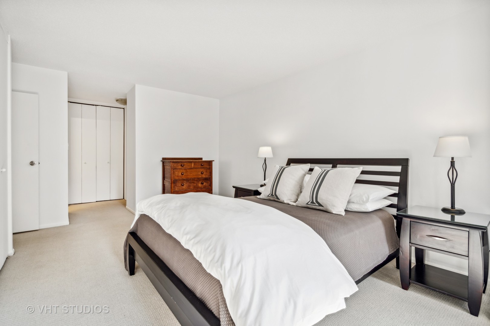 1313 North Ritchie Court, Unit 1304 Chicago, IL 60610 - Photo 11 of 20 a bedroom with a bed and window