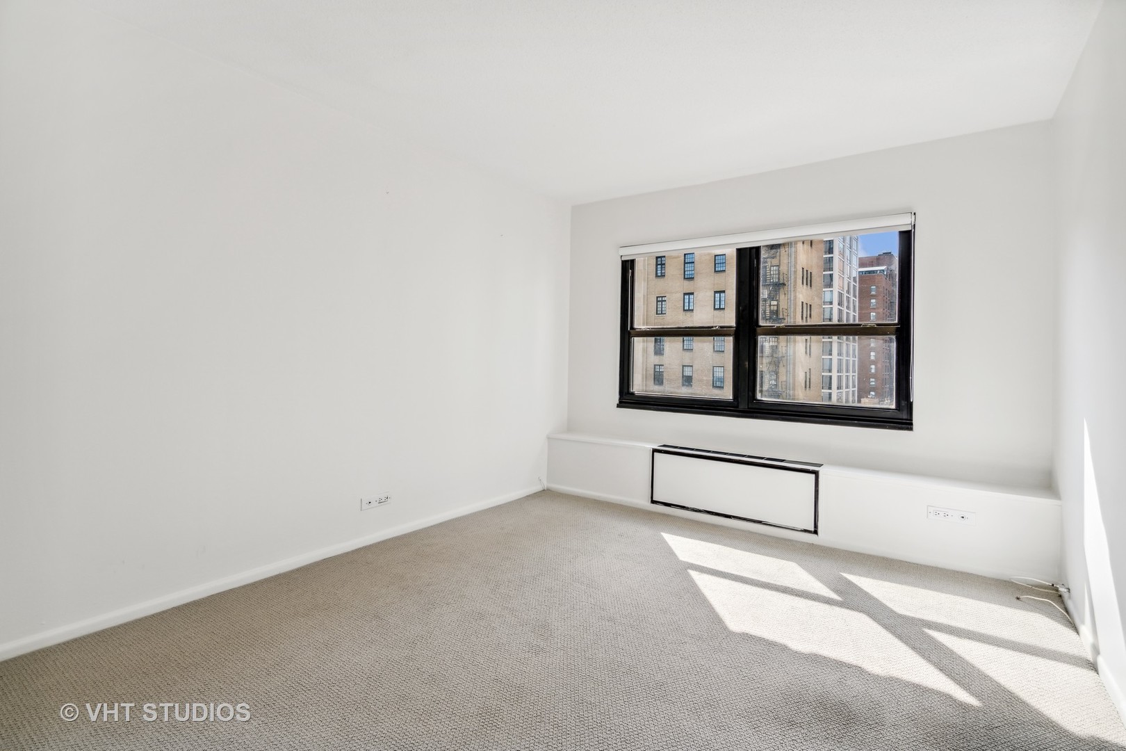 1313 North Ritchie Court, Unit 1304 Chicago, IL 60610 - Photo 14 of 20 an empty room with windows
