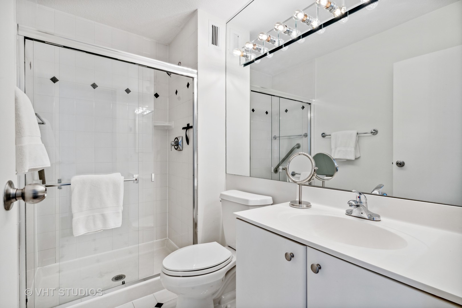 1313 North Ritchie Court, Unit 1304 Chicago, IL 60610 - Photo 16 of 20 a bathroom with a sink toilet double vanity and shower