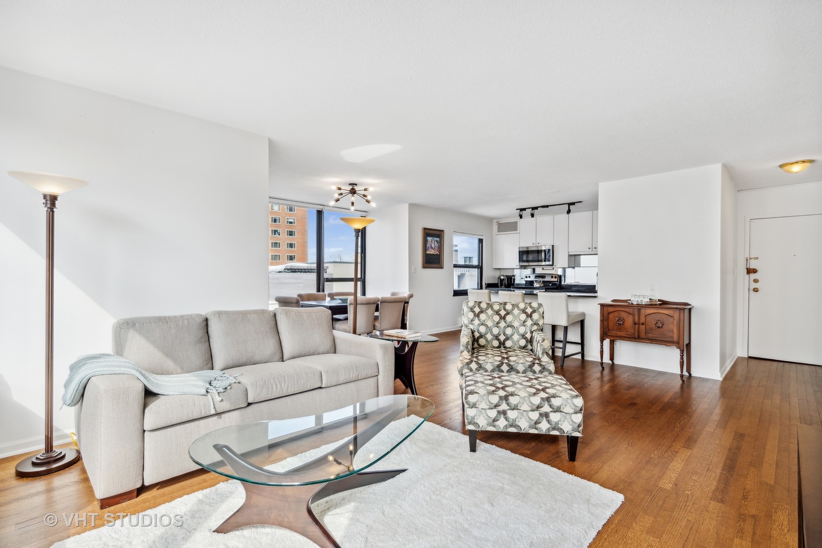 1313 North Ritchie Court, Unit 1304 Chicago, IL 60610 - Photo 6 of 20 a living room with furniture and a wooden floor