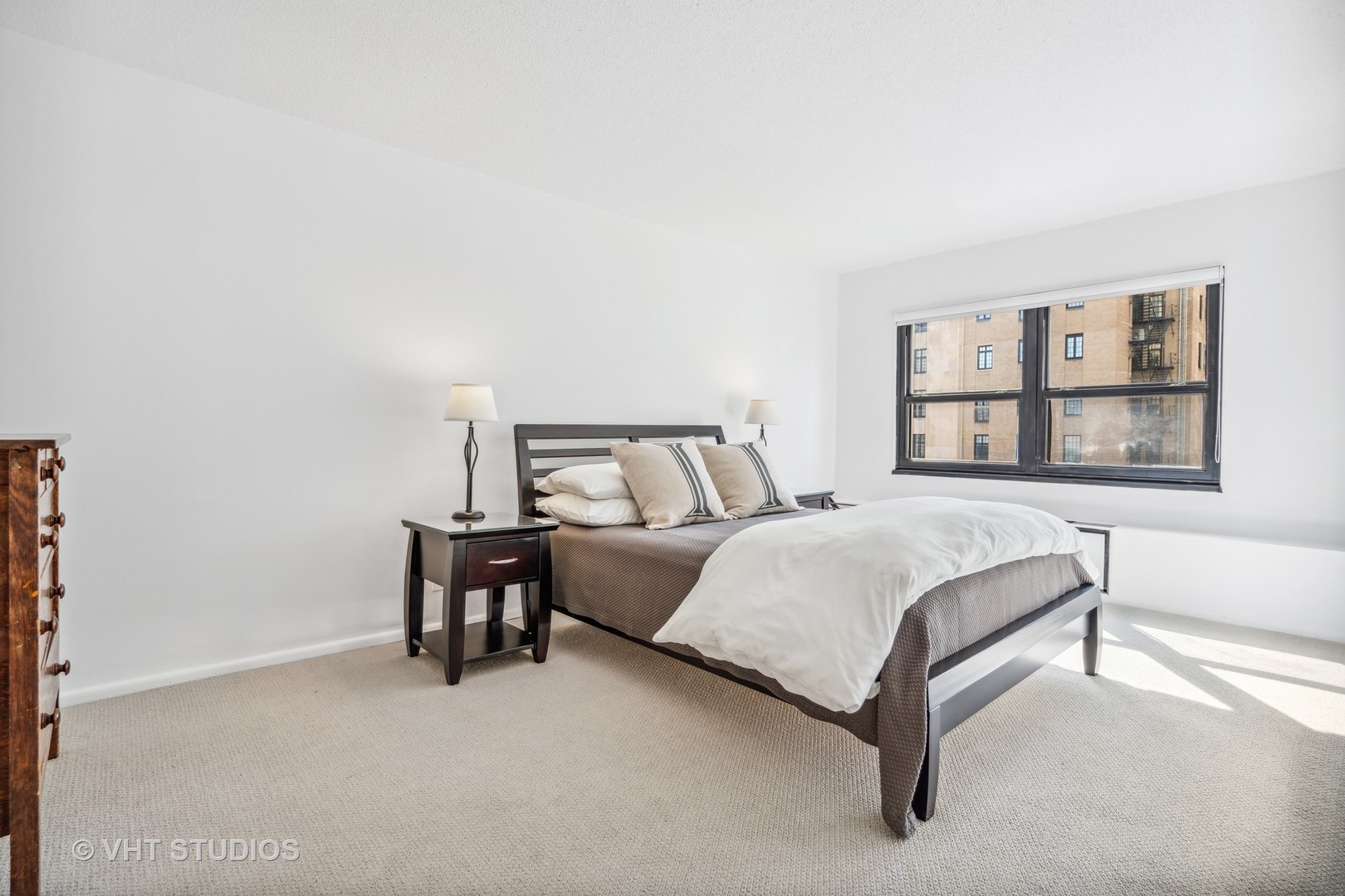 1313 North Ritchie Court, Unit 1304 Chicago, IL 60610 - Photo 10 of 20 a bedroom with a bed chair and window