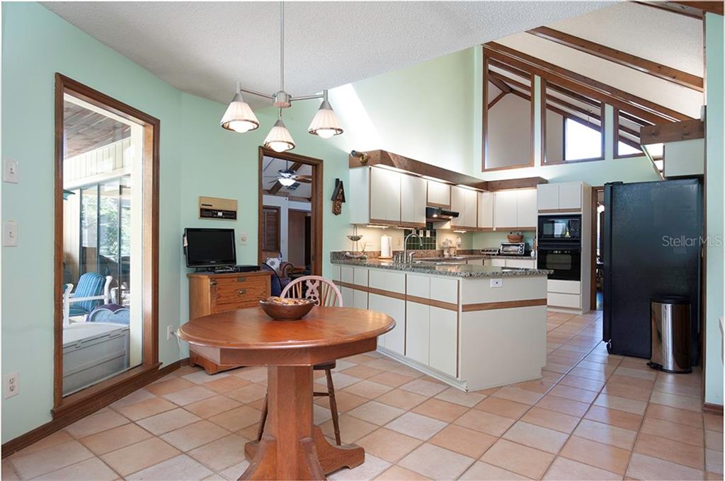 145 Spring Chase Circle Altamonte Springs, FL 32714 - Photo 16 of 54 The kitchen dinette area is large and has a perfect view and access to the lanai and pool.