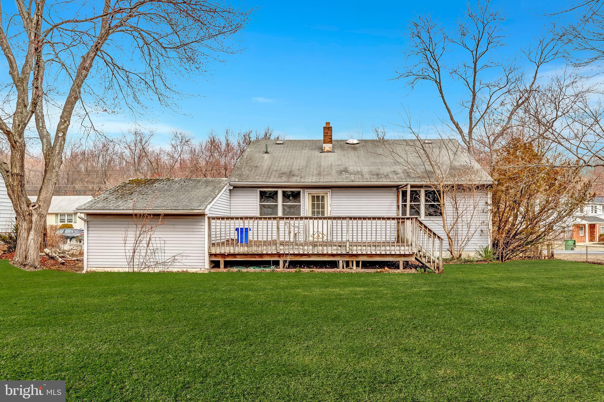 63 Baker Boulevard Marlton, NJ 08053 - Photo 3 of 10 a front view of a house with a yard and trees