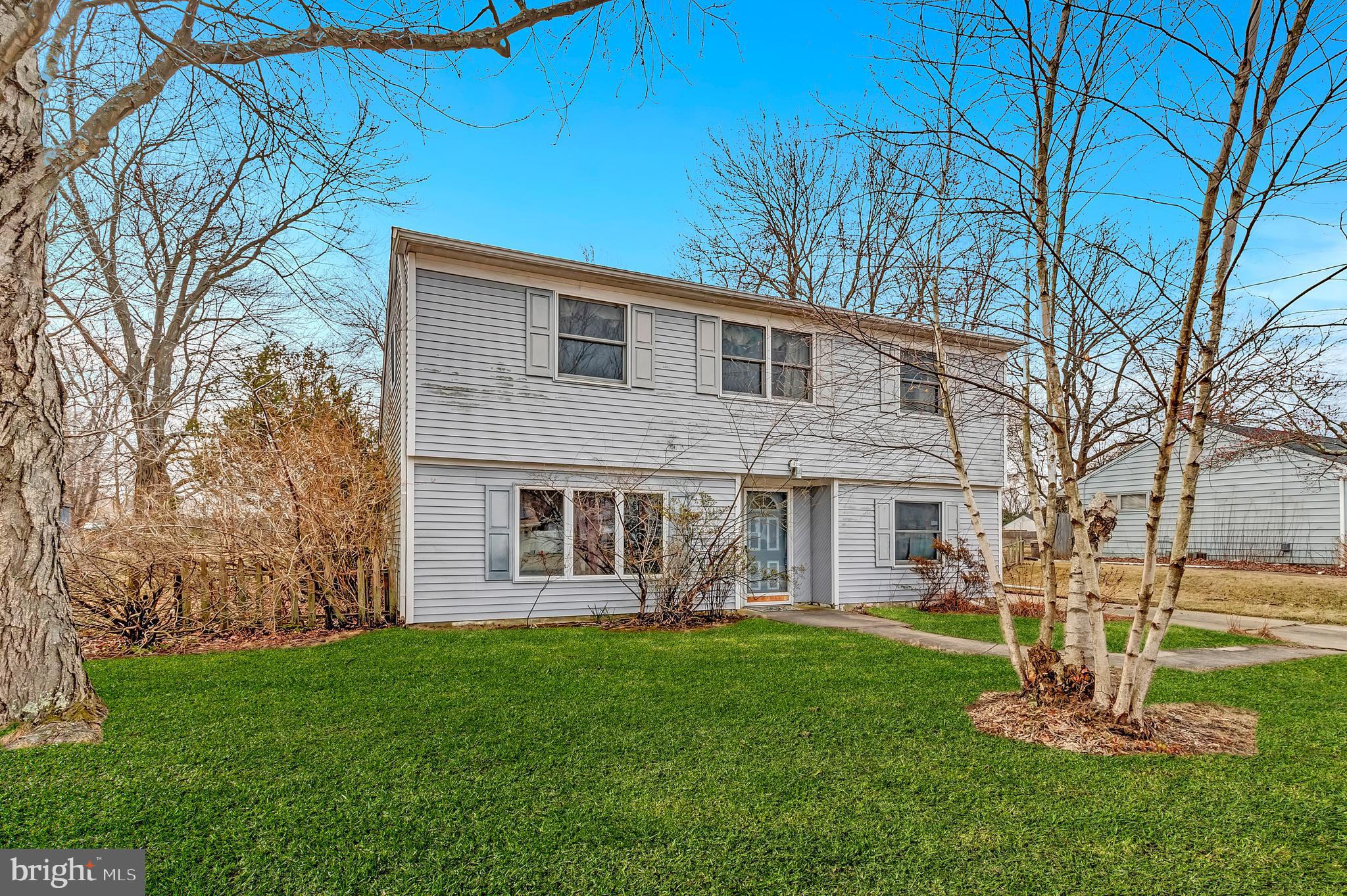 63 Baker Boulevard Marlton, NJ 08053 - Photo 5 of 10 a front view of a house with a yard
