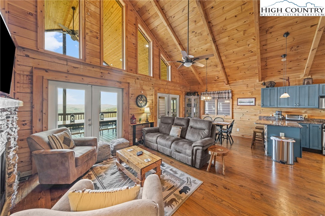 196 Eagle Nest Road Purlear, NC 28665 - Photo 13 of 36 a living room with furniture and wooden floor