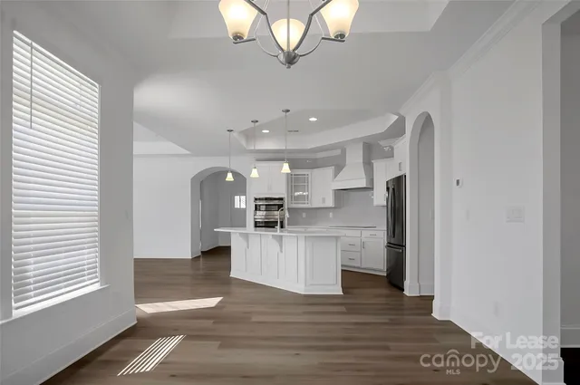 a kitchen with stainless steel appliances a refrigerator and a sink