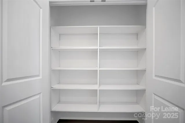 a view of an empty walk in closet