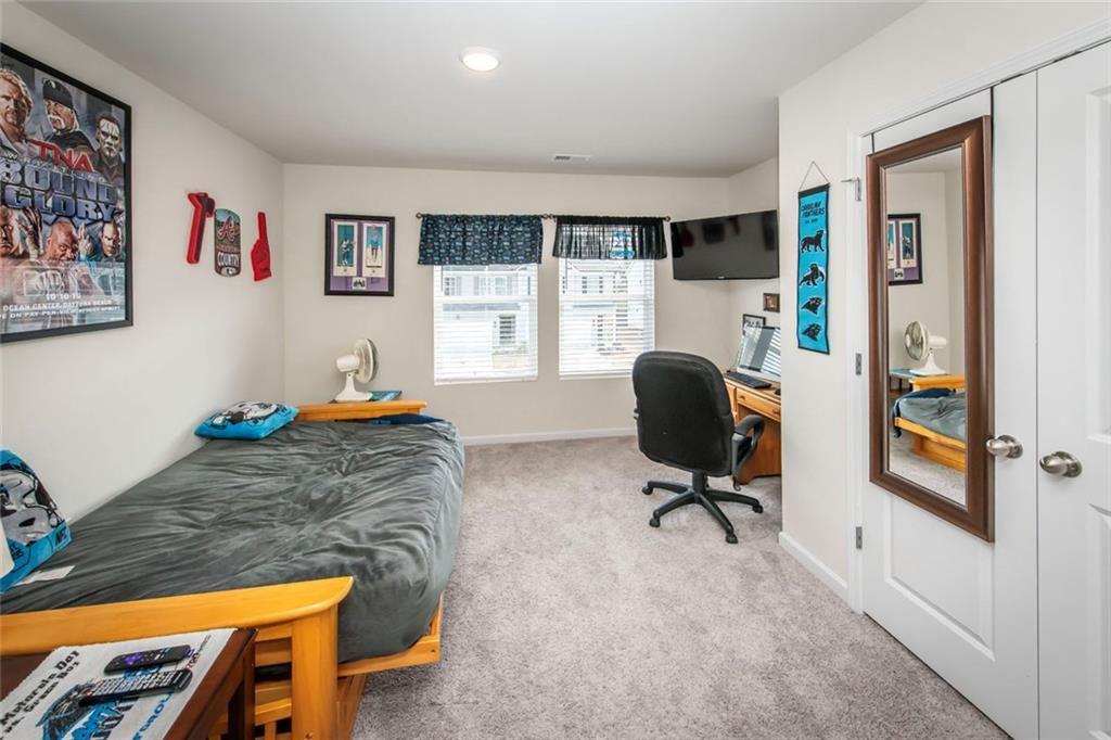1182 Westhampton Way Villa Rica, GA 30180 - Photo 15 of 26 a view of a workspace with furniture and a window