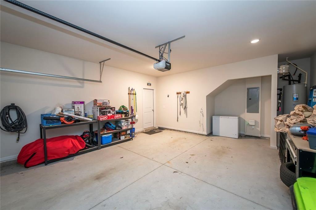 1182 Westhampton Way Villa Rica, GA 30180 - Photo 24 of 26 a view of a garage with rack and bicycle
