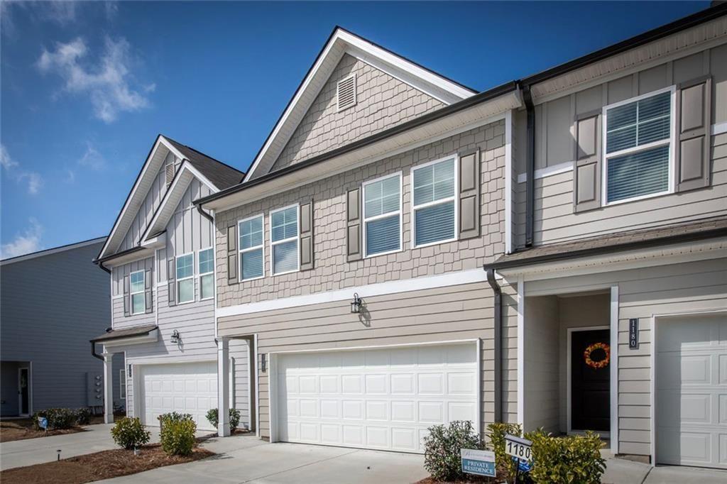 1182 Westhampton Way Villa Rica, GA 30180 - Photo 26 of 26 a front view of a house with a street
