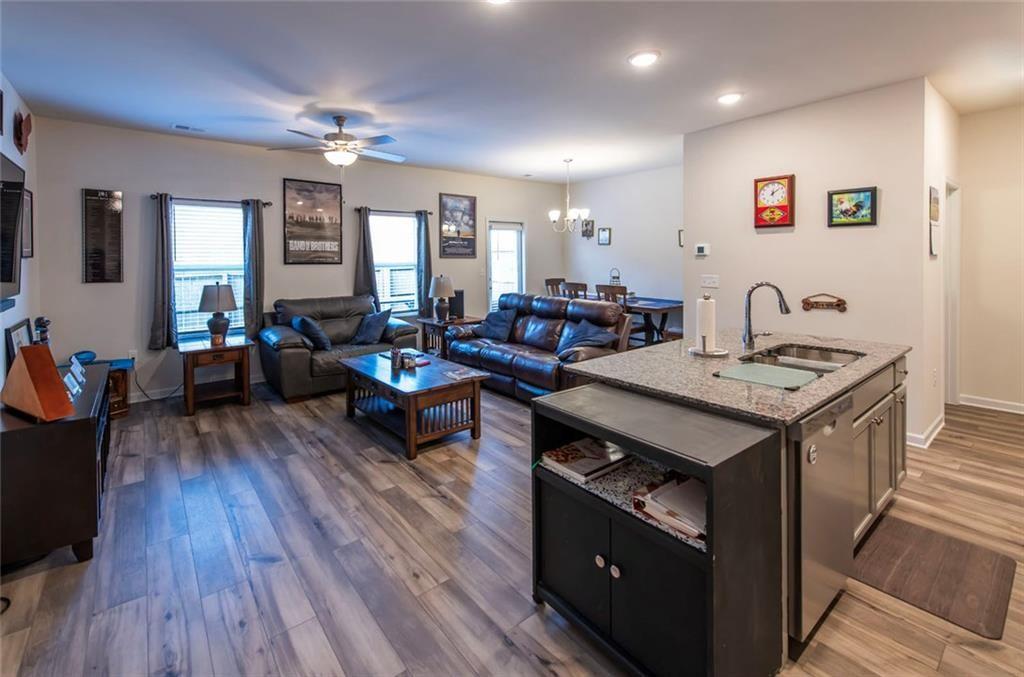 1182 Westhampton Way Villa Rica, GA 30180 - Photo 5 of 26 a living room with furniture and wooden floor