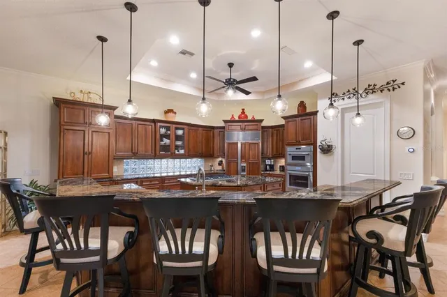 a bedroom with a bed and a large mirror