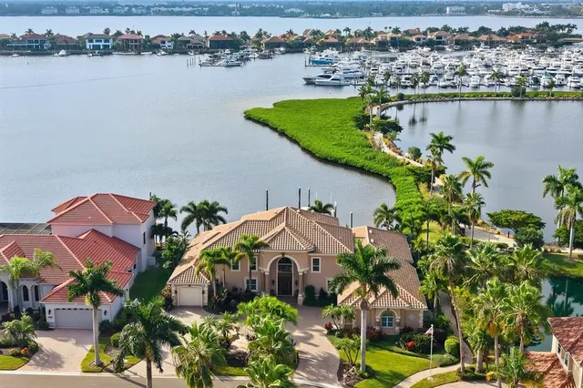 an aerial view of a house with yard swimming pool and outdoor seating