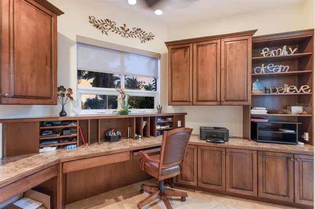 a view of a chairs and table in a patio