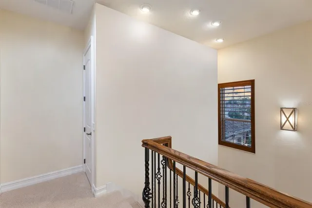 an aerial view of a house with yard swimming pool and outdoor seating