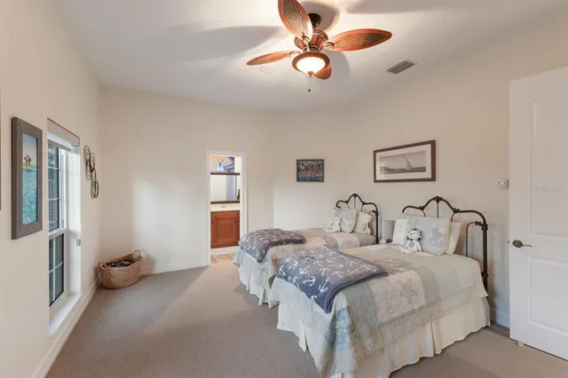 an aerial view of a house with outdoor space and lake view
